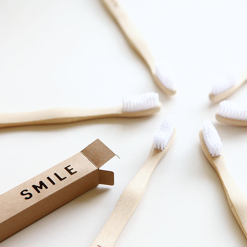 Smile toothbrush wrap for guest tray