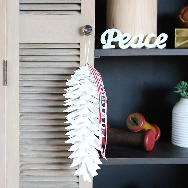 White washed pine cones with tassles 6